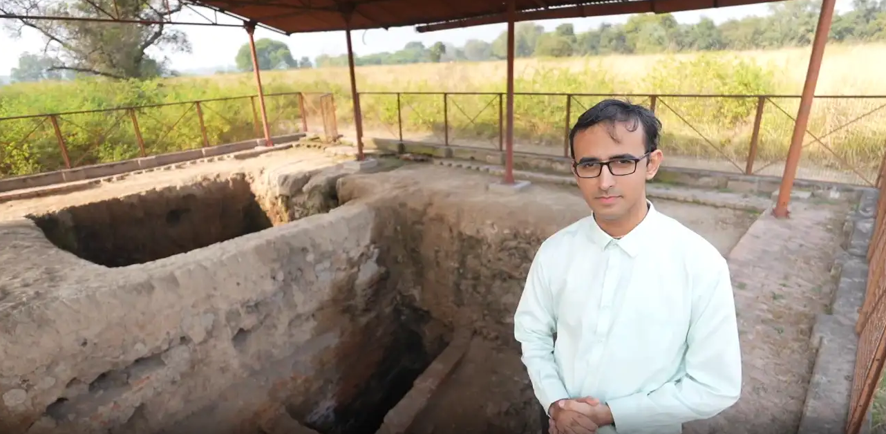 Traveller exploring the cultural and architectural heritage of Bharat with maps, field notes and monuments